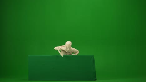 green screen isolated chroma key video capturing a mummy dancing and singing actively into the