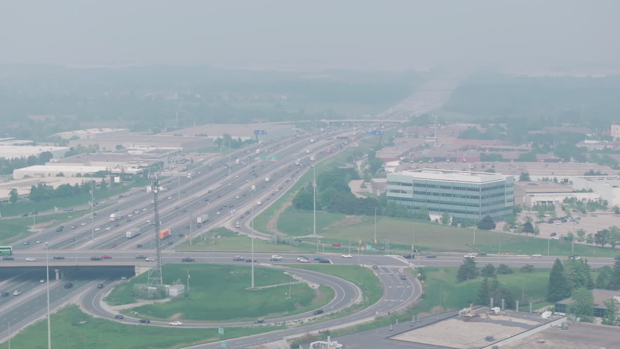 The highway in mississauga, ontario, canada, covered in smoky haze from wildfires, aerial view