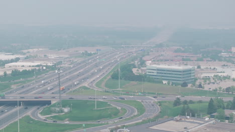 the highway in mississauga, ontario, canada, covered in smoky haze from wildfires, aerial view