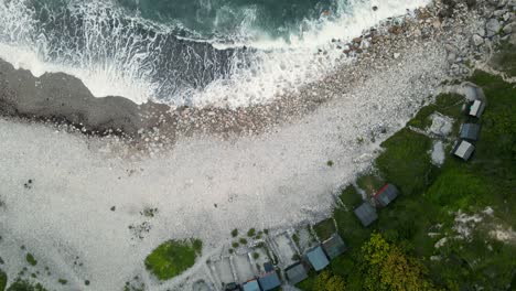 4k footage of a drone flying over church ope's beach, panning up on a view of the ocean during the sunset, on portland, dorset, in the united kingdom