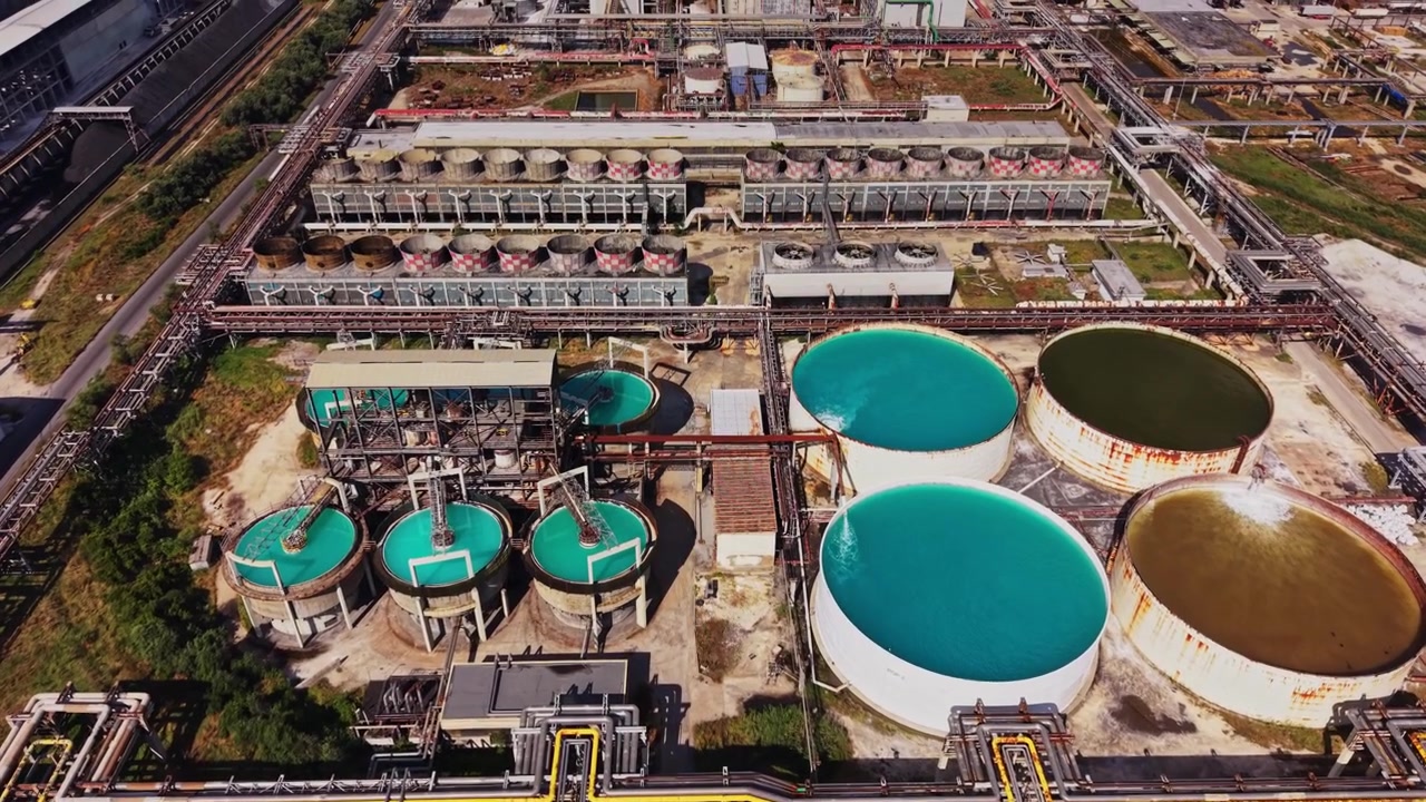 Industrial site with large tanks and water treatment facilities