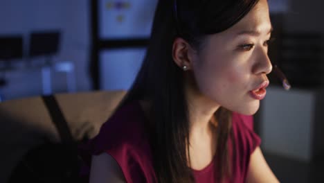 video of asian female consultant working late in office