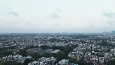 4K-Aerial-Shots-of-New-Delhi-Residential-Suburbs-on-a-beautiful-day-gliding-over-Rooftops,-streets,-parks-and-markets-in-India