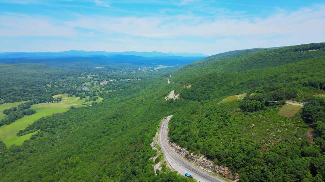 Aerial drone video footage of a scenic mountain highway byway in the Appalachian Mountains. This is in the Shawangunk Mountain sub-range in new york’s Hudson valley during summer time.