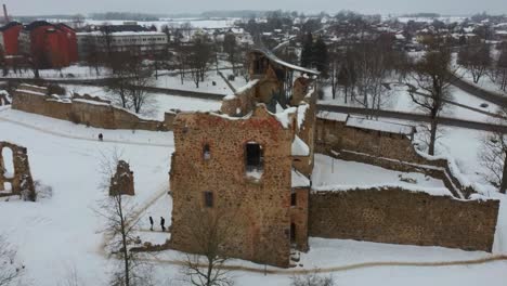 ruins of ancient livonian order's stone medieval castle latvia aerial drone top shot from above