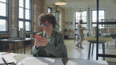 architects using phones in a modern architectural studio