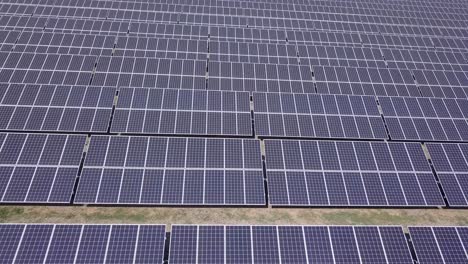 Full-frame-pattern-of-black-rectangular-solar-panels-in-massive-array