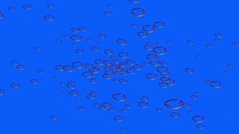 a lot of colorful soap bubbles fly across blue background