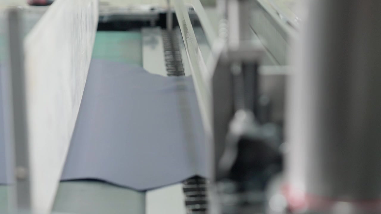 Industrial Finisher Machine Processing A Tanned Animal Hide During Production Of Leather In A Factory.