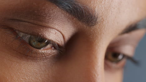 close up macro eyes blinking natural female beauty cosmetics concept