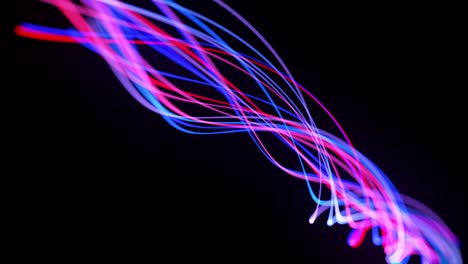 light flow bg in 4k. abstract looped background with light trails, stream of red blue neon lines in space move to form looped spiral shapes. modern trendy motion design background.