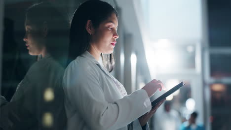 Doctor,-woman-and-typing-with-tablet