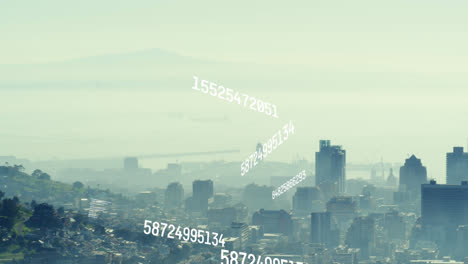 animation of changing numbers and data processing against aerial view of cityscape