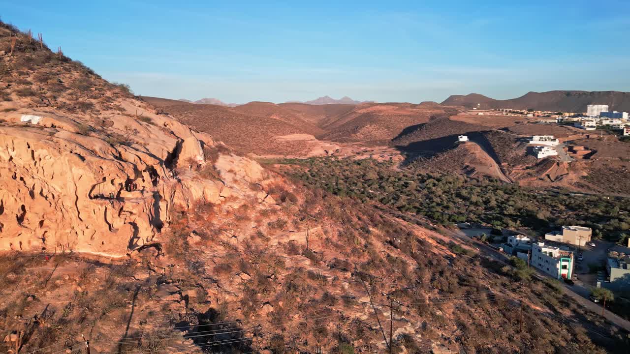 La paz hillsides, desert landscape with distant homes and rocky terrain, aerial view