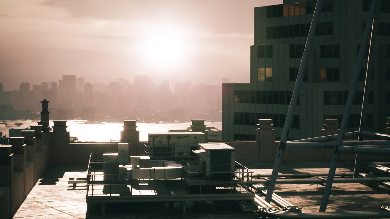 Sunset over the city skyline viewed from a rooftop terrace during golden hour