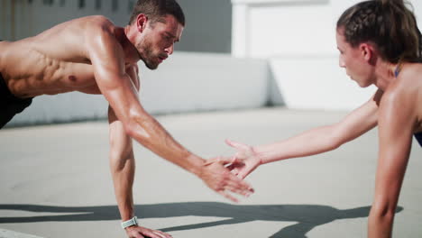 couple doing push-ups outdoors