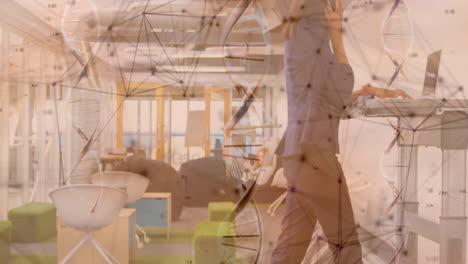 Woman typing on treadmill desk in tech office, with network graphic and DNA helix overlay
