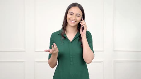 Happy-Indian-woman-talking-on-a-call