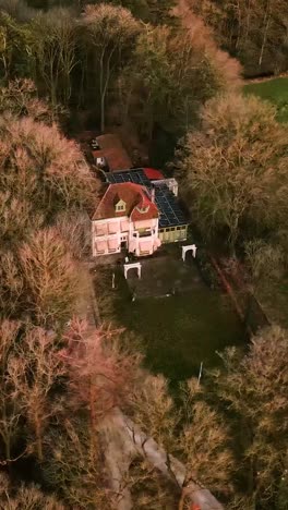 aerial view of a house in a wooded area