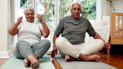 senior couple doing yoga at home