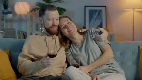 couple enjoying wine at home