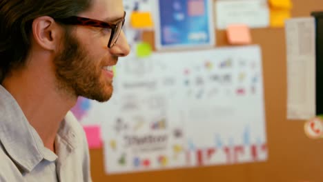 graphic designer using graphic tablet at desk