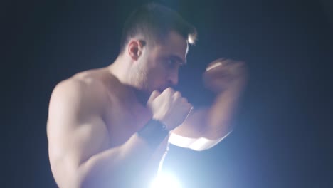 boxing against black background, shadow boxing. to practice.