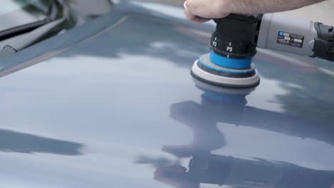 Machine-polishing-silver-blue-car-hood