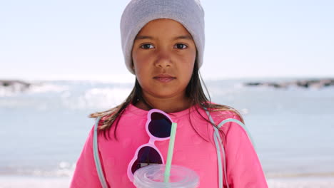 girl child, face and beach with juice