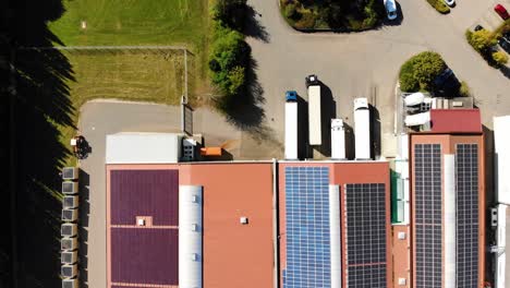 Trochtelfingen-food-production-company-from-above,-topview,-rooftops-with-solar-panels