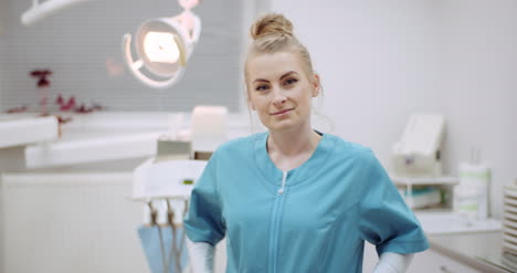 Portrait-Of-Positive-Female-Doctor-At-Clinic