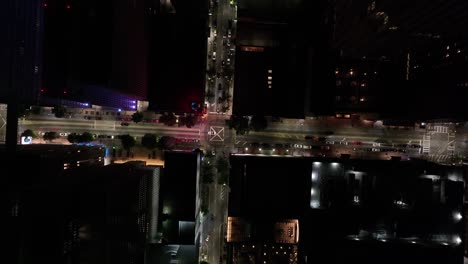 aerial view of road intersection with street lights and moving cars in american city at night, downtown atlanta, georgia, usa