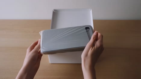 unboxing a white product box