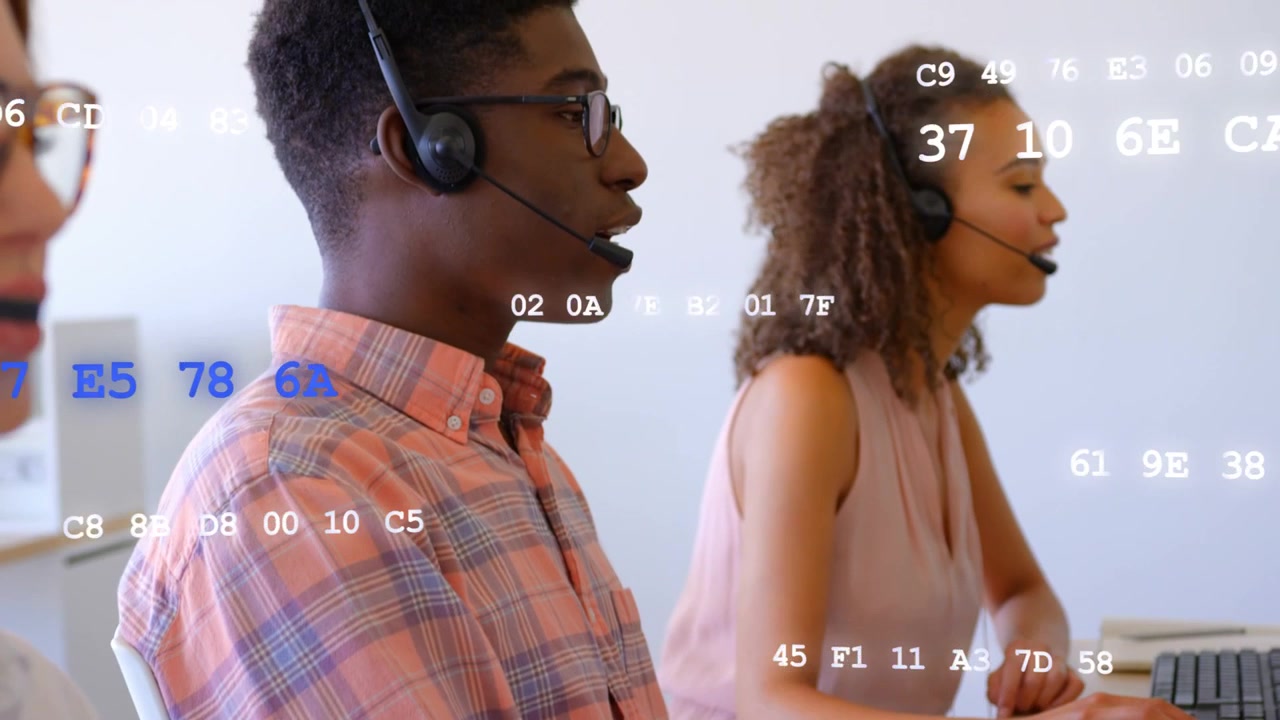 Call arriving, male rep adjusting headset and speaking, female typing, code overlay aiding support
