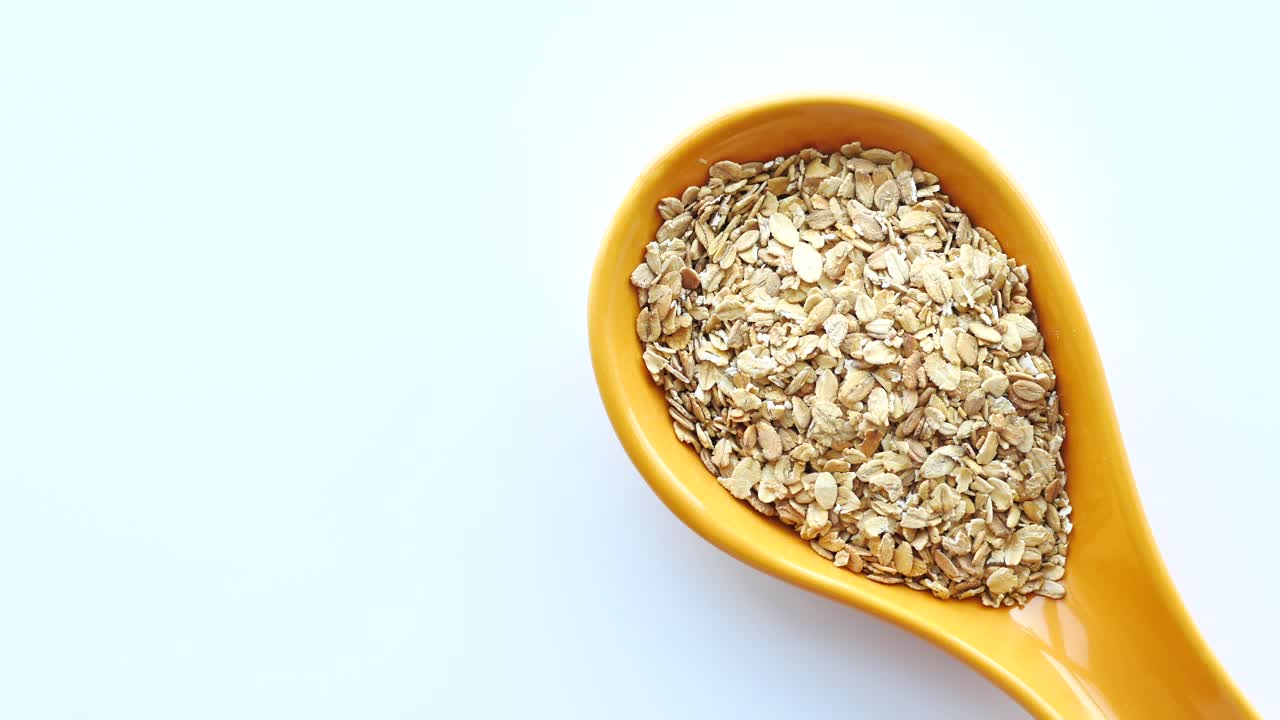 Oatmeal in a Yellow Spoon