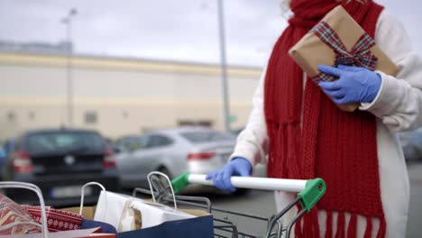 Side-view-of-woman-comes-back-from-Christmas-shopping