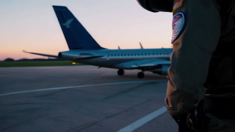 pilot at airport at sunset