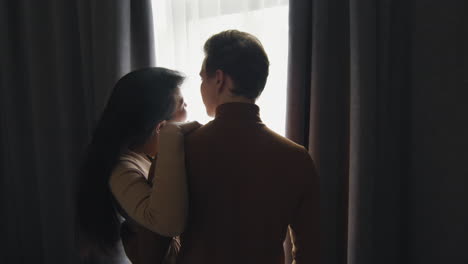 couple looking out window