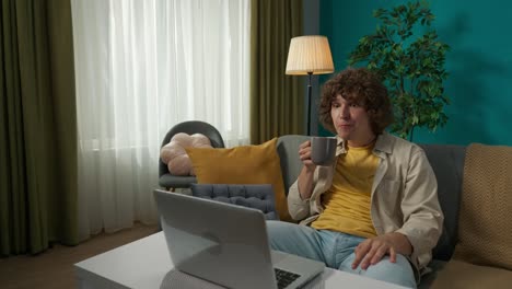 young man having a video call at home