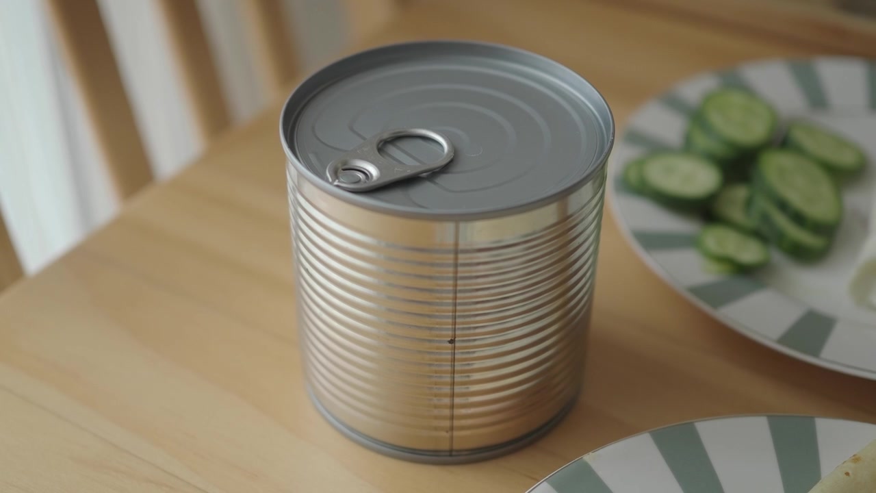 Closed Metal Food Can on a Wooden Table