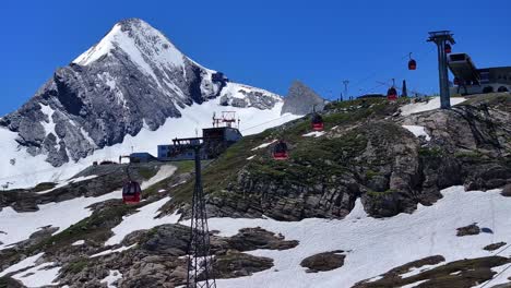 cable cars take skiers up high snowy mountains