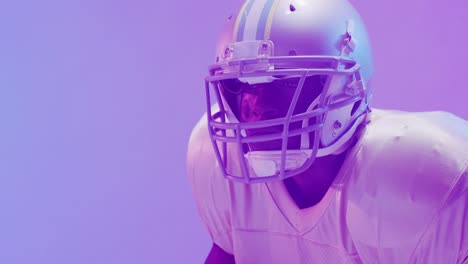 Video-of-african-american-american-football-player-over-purple-neon-background