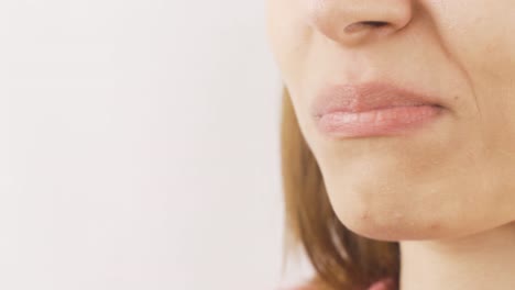 Close-up-portrait-of-woman-eating-chocolate-balls.-Eating-chocolate.