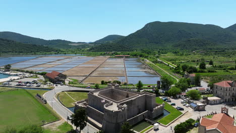 kastio fort with a view of salt flats and mountains in ston, croatia. - aerial shot
