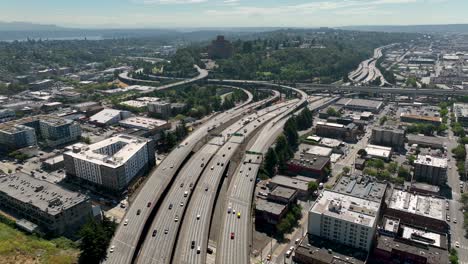 wide drone shot of cars commuting on seattle's freeway system