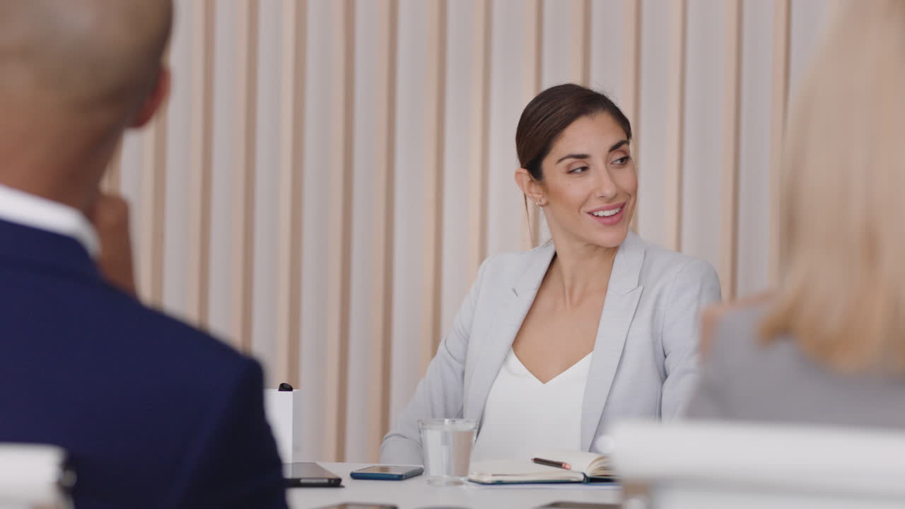 beautiful business woman meeting with colleagues sharing creative ideas for startup project discussing corporate strategy in office boardroom