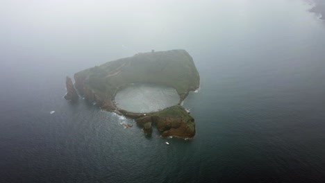 round volcanic crater in small islet off sao miguel island in azores