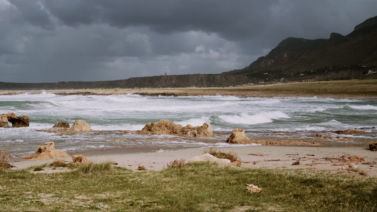 Stormy Beach Scene with Rocky Coastline