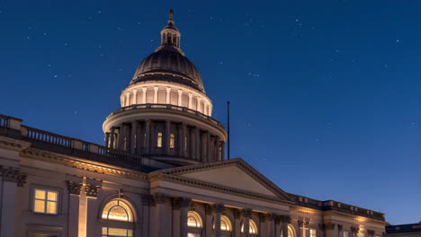 illuminated capitol building dome at night with stars