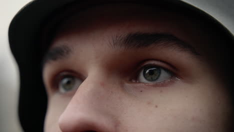 close-up of a young person's face with a helmet